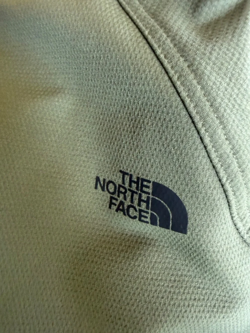 olive green The North Face Tekno Ridge Hoodie features a kangaroo pocket